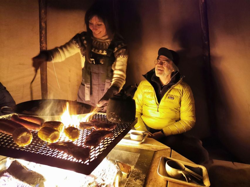 Premium Aurora Snowmobile Ride With Panoramic Views - A fire-lit dinner inside the tipi