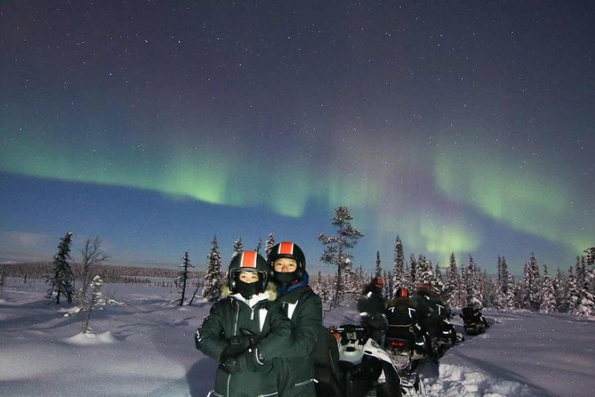 Snowmobile Aurora Expedition with dinner - Riding through forests, lakes, and the Torne River