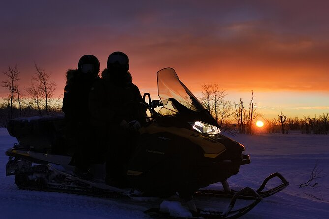 Snowmobile Safari to Lapland viewpoint - Coffee and ice fishing on a frozen lake