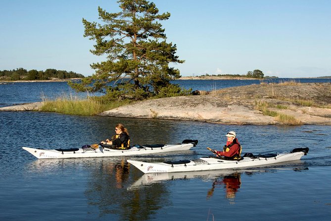 Stockholm Archipelago Kayaking Day Tour - Following the guide through rocky islands
